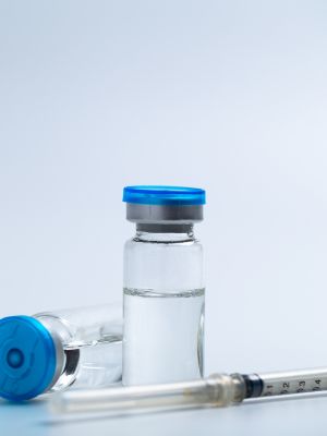 syringe and vials of peptides